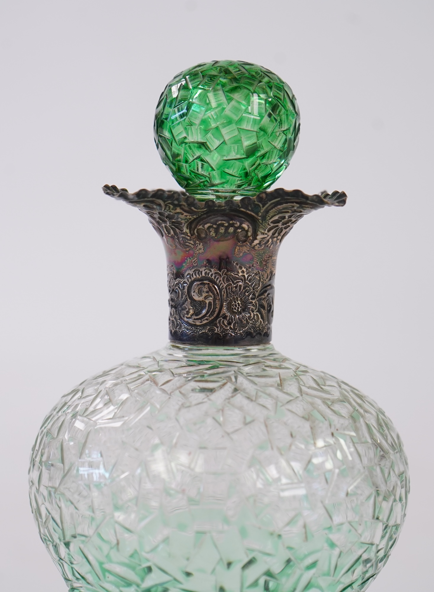 Attributed to Stevens and Williams of Stourbridge, a green flashed and cut pinched glass decanter